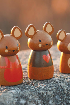 Three adorable wooden mouse figurines stand on a textured surface, each displaying unique colors and features. The charming designs highlight their playful expressions and eco-friendly construction.