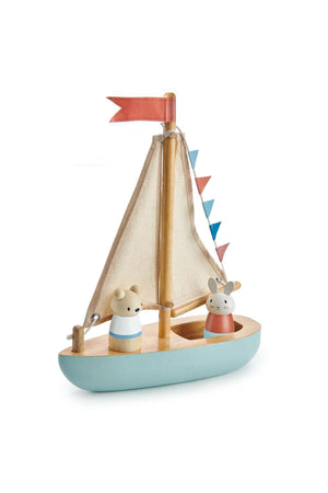 A wooden sailboat features two charming mouse figures, Bubble and Squeak, with fabric sails and colorful bunting.