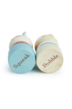Two wooden figures labeled Squeak and Bubble, featuring soft colors and a smooth finish, designed for imaginative play.