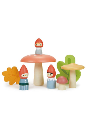 A charming set of wooden gnome figures in vibrant colors, featuring red hats and playful expressions, alongside colorful mushroom and leaf shapes. Ideal for imaginative storytelling and eco-friendly play.