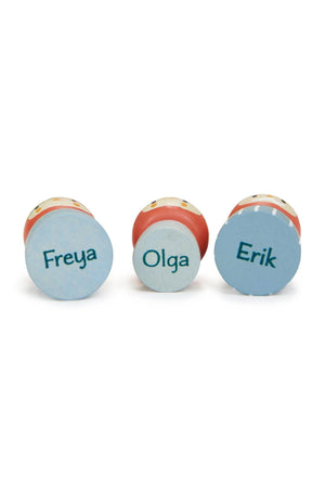 Three wooden gnome figures, Freya, Olga, and Erik, are displayed with colorful bases. Each figure features a unique color and playful design, ideal for imaginative storytelling and sustainable play.