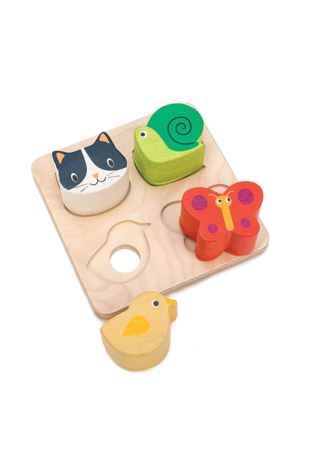 Wooden animal-shaped puzzle pieces on a light wooden board, featuring a cat, snail, butterfly, and chick.