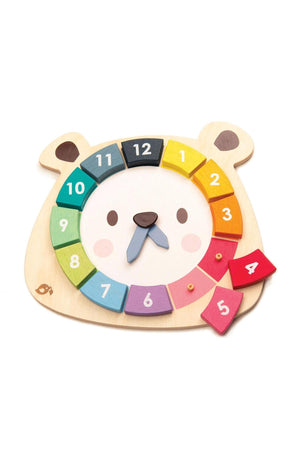 A round wooden bear-shaped toy features colorful numbers from 1 to 12, designed for teaching children counting and number recognition. Made from sustainable materials, it promotes eco-friendly play.
