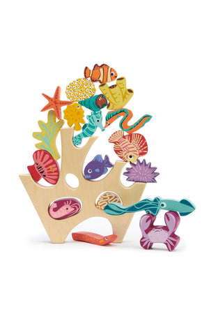Colorful wooden stacking toy featuring various sea creatures and coral shapes, promoting imaginative play for children.