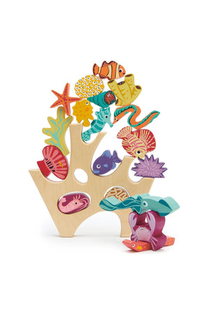 A colorful wooden stacking toy features various sea creatures, including a crab and fish, on a coral-shaped base.