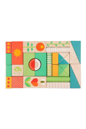 A colorful arrangement of wooden blocks featuring various patterns and shapes, including flowers, circles, and geometric designs, ideal for creative play and construction for toddlers.