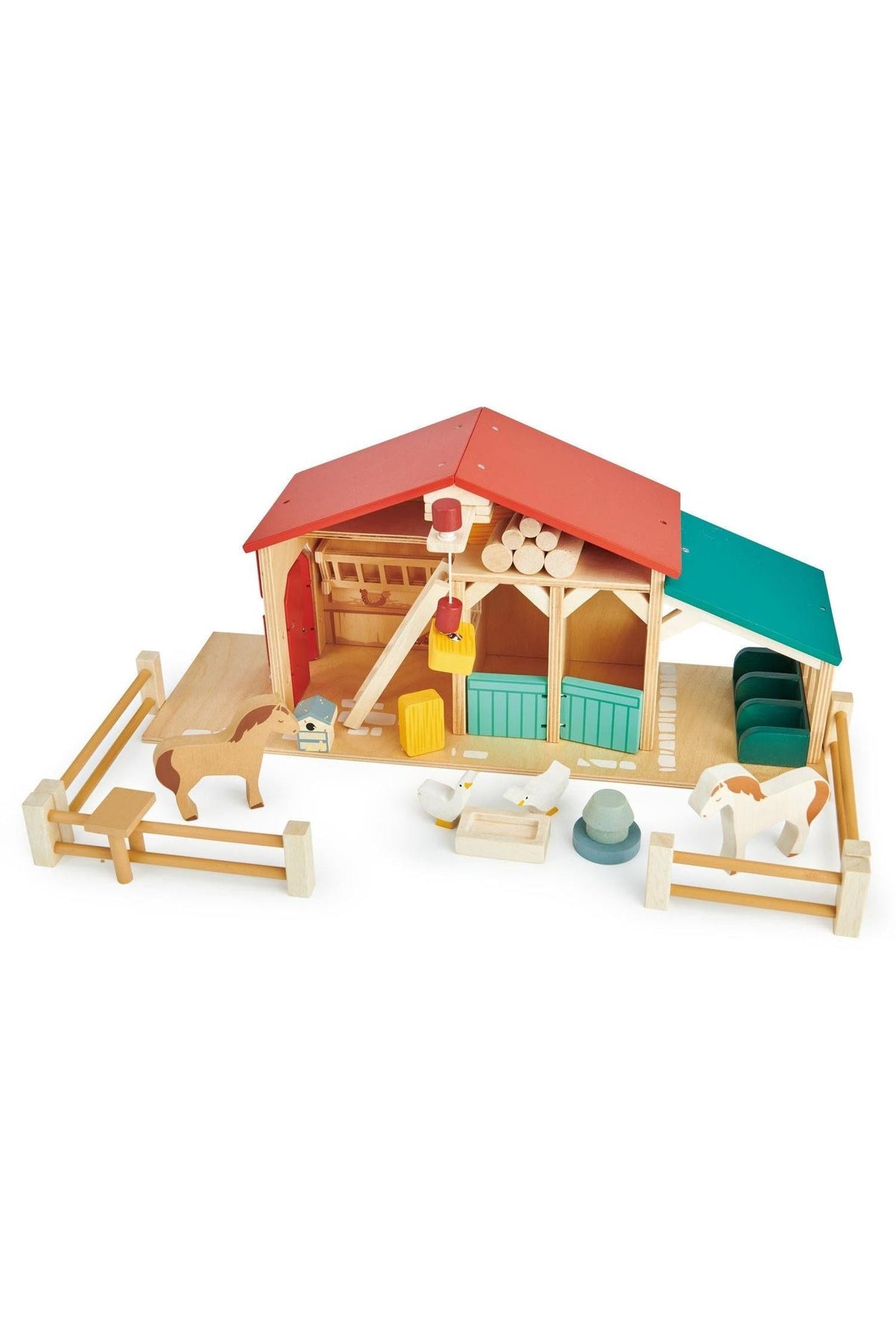 Colorful wooden farm playset featuring a red and green barn, stables, and animal figures made from sustainable materials.
