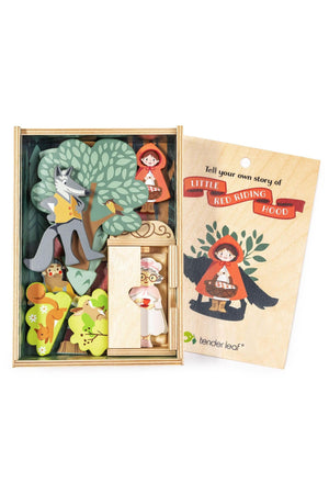 A wooden storytelling set by Tender Leaf features colorful characters and a tree, allowing children to recreate the Little Red Riding Hood tale. The eco-friendly materials promote imaginative play.