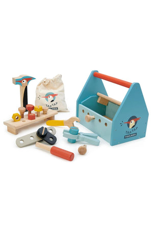 Colorful wooden toy toolbox by Tender Leaf Toys includes tools like a hammer, pliers, and screws, promoting imaginative play.