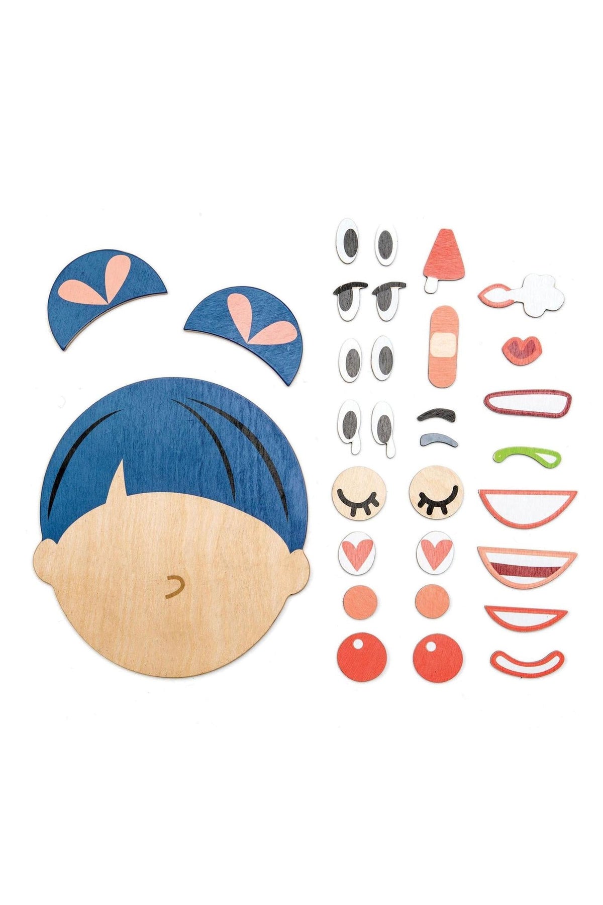 A wooden face base with blue hair and pink heart-shaped buns, accompanied by various magnetic facial expression pieces.