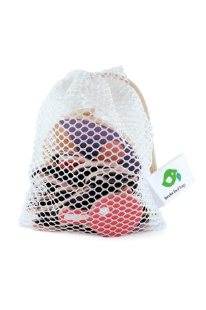 A mesh bag contains colorful wooden facial pieces from Tender Leaf Toys, showcasing a variety of shapes and expressions.