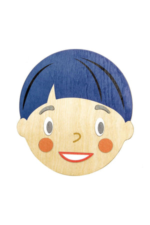 A wooden face-shaped piece features a smiling expression, blue hair, and colorful facial details, promoting emotional development for children.
