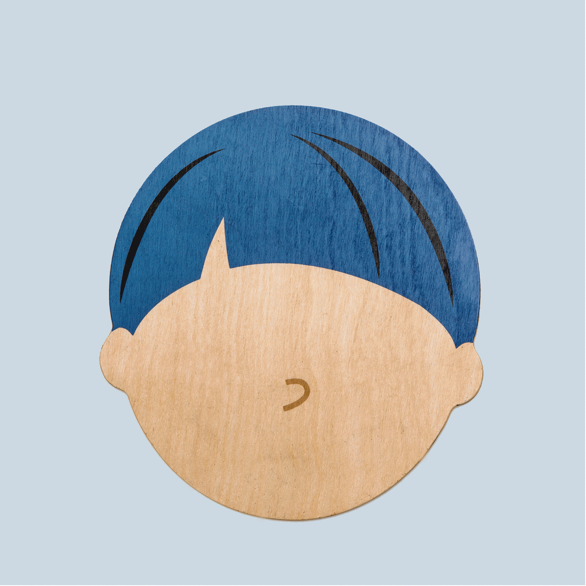 A wooden face-shaped base with a light brown tone and blue hair design. Ideal for promoting emotional expression in children.