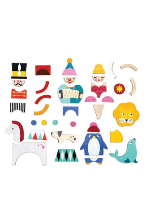 A variety of colorful wooden pieces, including circus characters and animals, designed for imaginative play.