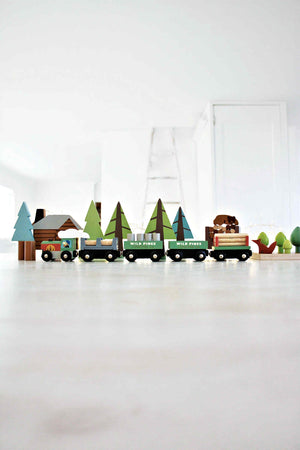 A colorful wooden train set by Tender Leaf Toys includes a moving engine, carriages, and various trees and animals, set against a bright, minimalist background. Ideal for imaginative play.