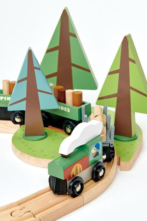 A colorful wooden train set features a green engine and three carriages transporting logs, surrounded by stylized wooden trees. This sustainable toy encourages imaginative play and storytelling for young children.