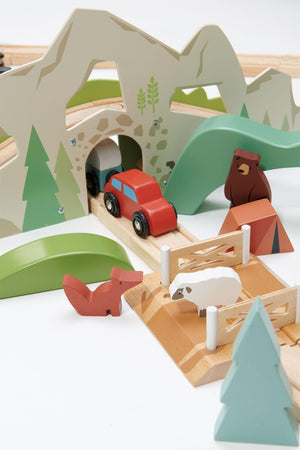 Colorful wooden toy train set featuring a red car, forest animals, and scenic mountains. The eco-friendly design encourages imaginative play, ideal for children and promotes sustainable, family-friendly fun.