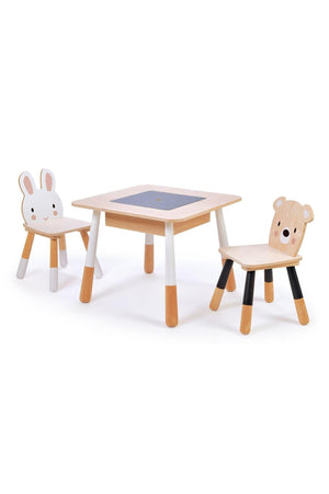 A sustainable wooden table and two chairs designed for toddlers, featuring playful bear and bunny face back panels. The table includes a removable chalkboard panel for creative play.