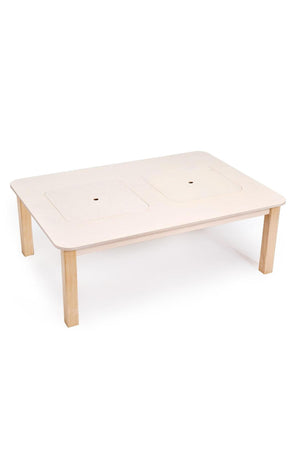 Light wooden play table with two recessed compartments, designed for toddlers. Ideal for various tabletop activities, it features a clean, modern style and sturdy construction for safe play.