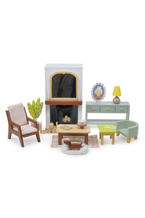 Wooden dollhouse furniture set with fireplace, armchair, and dresser. Includes a dog figure and decorative accessories.