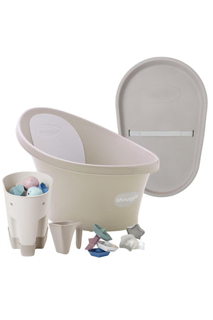 Shnuggle baby bath set with bum bump support, grey changing mat, toy organizer, and accessories in soft pastel colors.