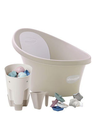 Shnuggle baby bath set includes a beige tub, white storage caddy, jug, and colorful bath toys.