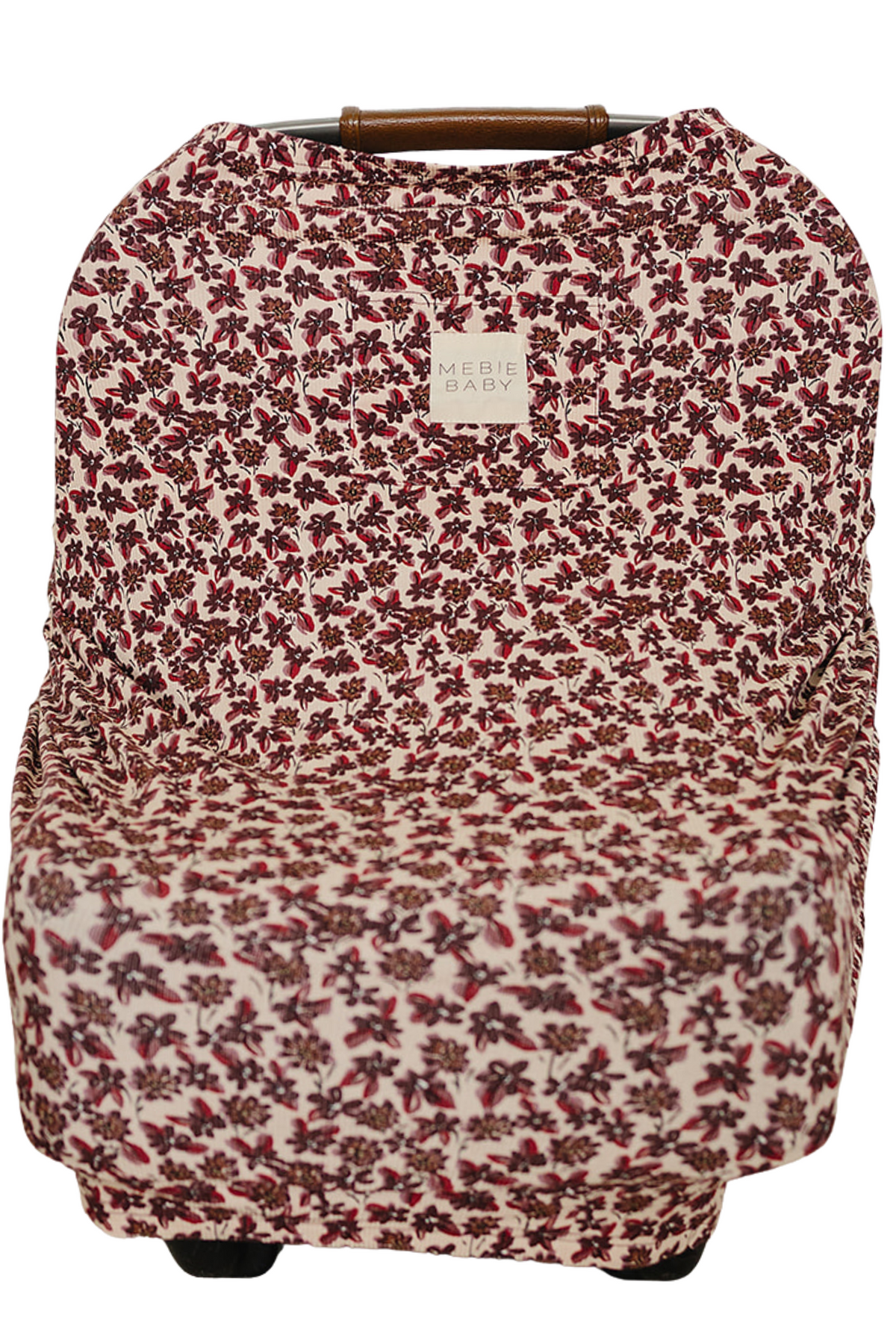 A floral-patterned nursing cover made from soft, breathable bamboo fabric features a ribbed texture. It is designed for versatile use, including as a car seat or shopping cart cover.