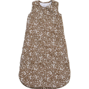 A soft brown floral sleep sack features a delicate white floral pattern. Made from breathable bamboo fabric, it offers a cozy and stylish option for little ones during sleep.