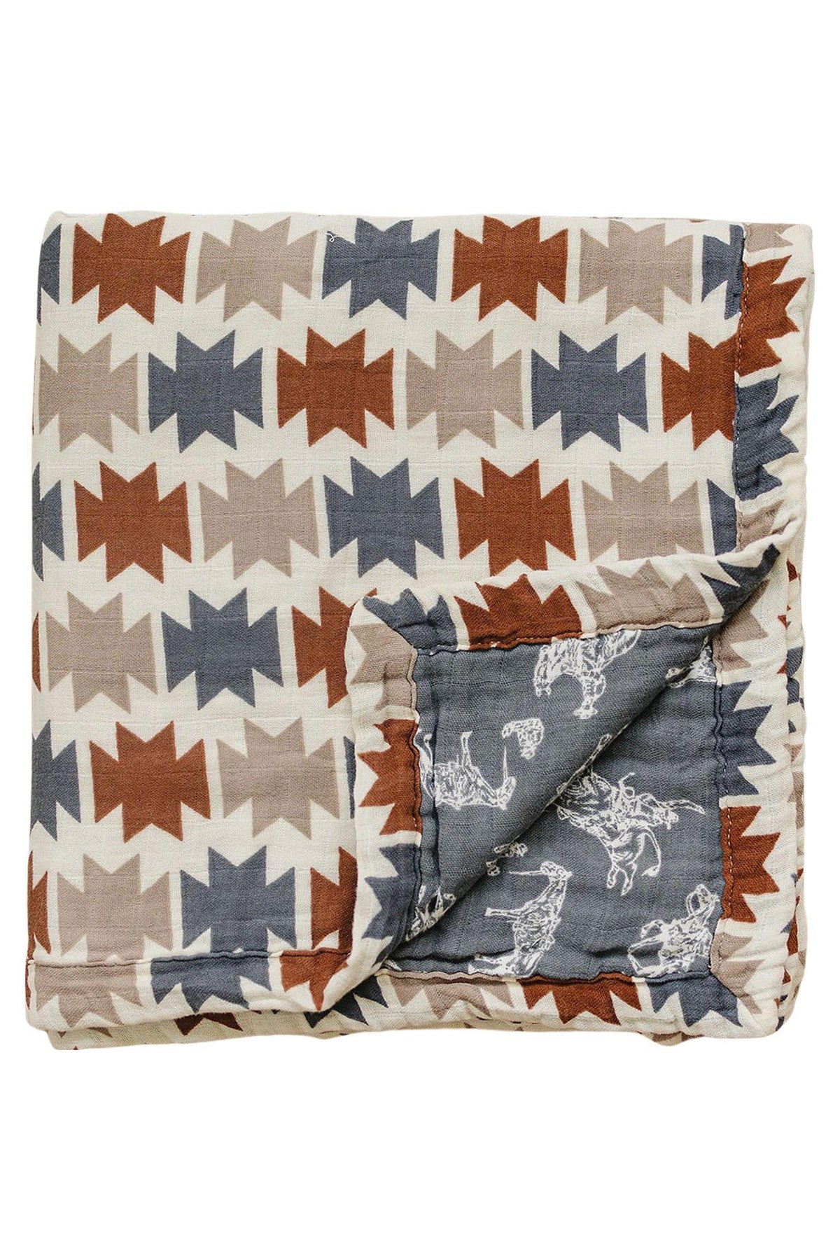 Folded muslin crib quilt with a Western Aztec pattern in brown, gray, and blue, featuring rodeo designs.