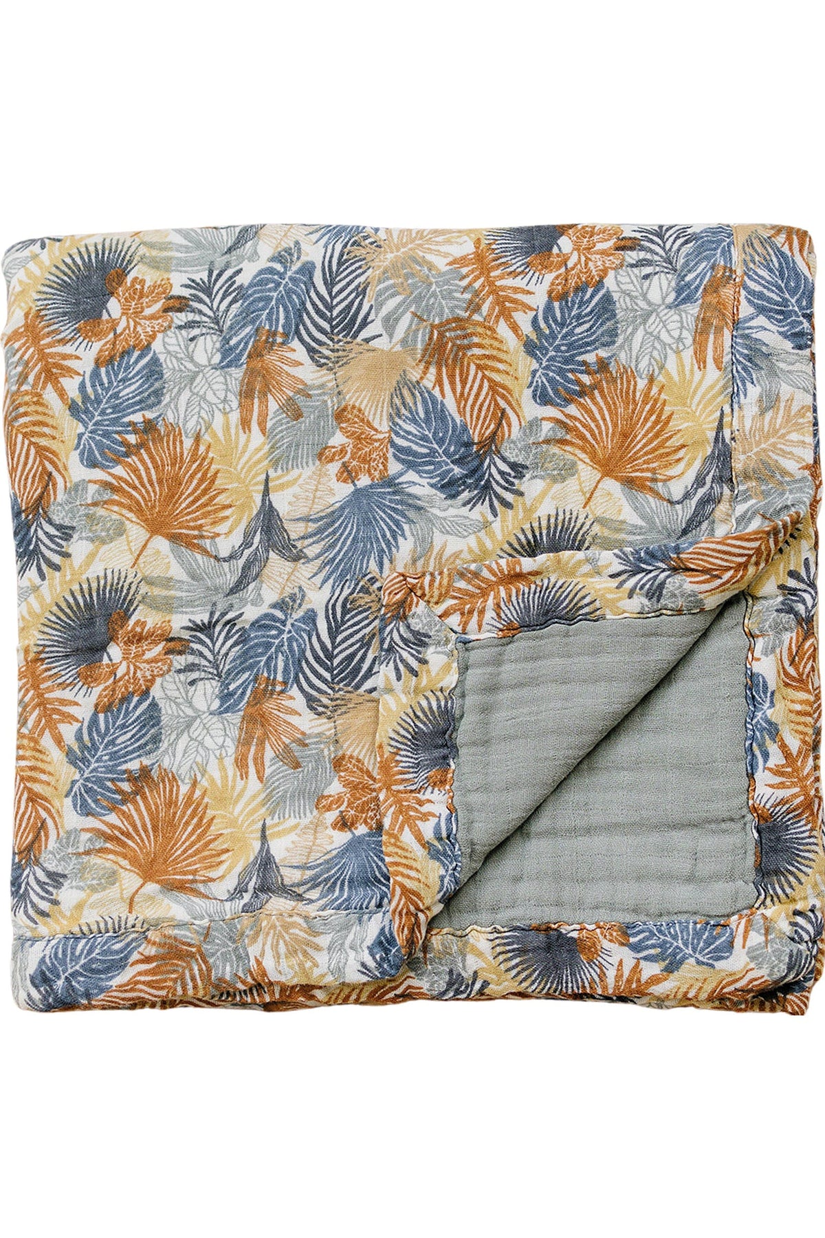 Colorful muslin quilt featuring a tropical leaf pattern in orange, blue, and beige tones with a folded corner.