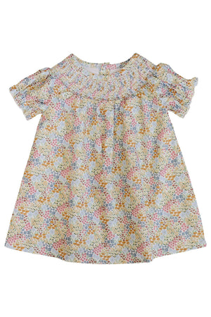 Brightly colored floral dress featuring short sleeves and a smocked neckline, made from soft, breathable organic cotton. Ideal for babies, this playful dress is perfect for warm summer days.