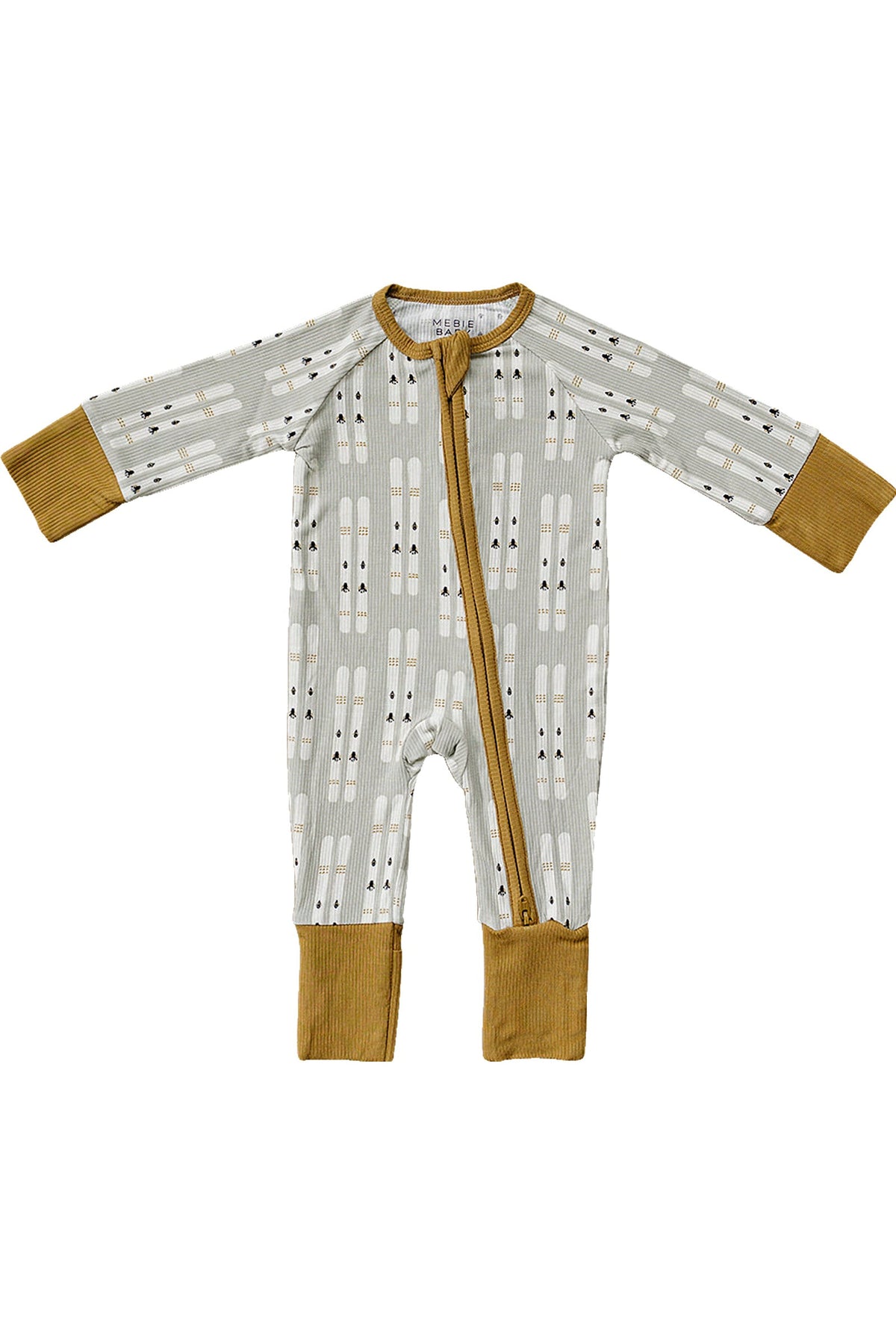 Gray baby pajama with ski pattern, featuring mustard cuffs and zipper. Made from eco-friendly bamboo fabric.