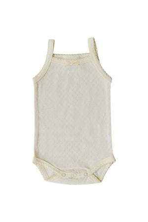Cream-colored pointelle tank bodysuit with adjustable straps and snap closures at the bottom, suitable for baby girls.