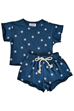 Navy cotton short set with white daisy print, featuring a raw hem and rope tie waistband. Perfect for kids.