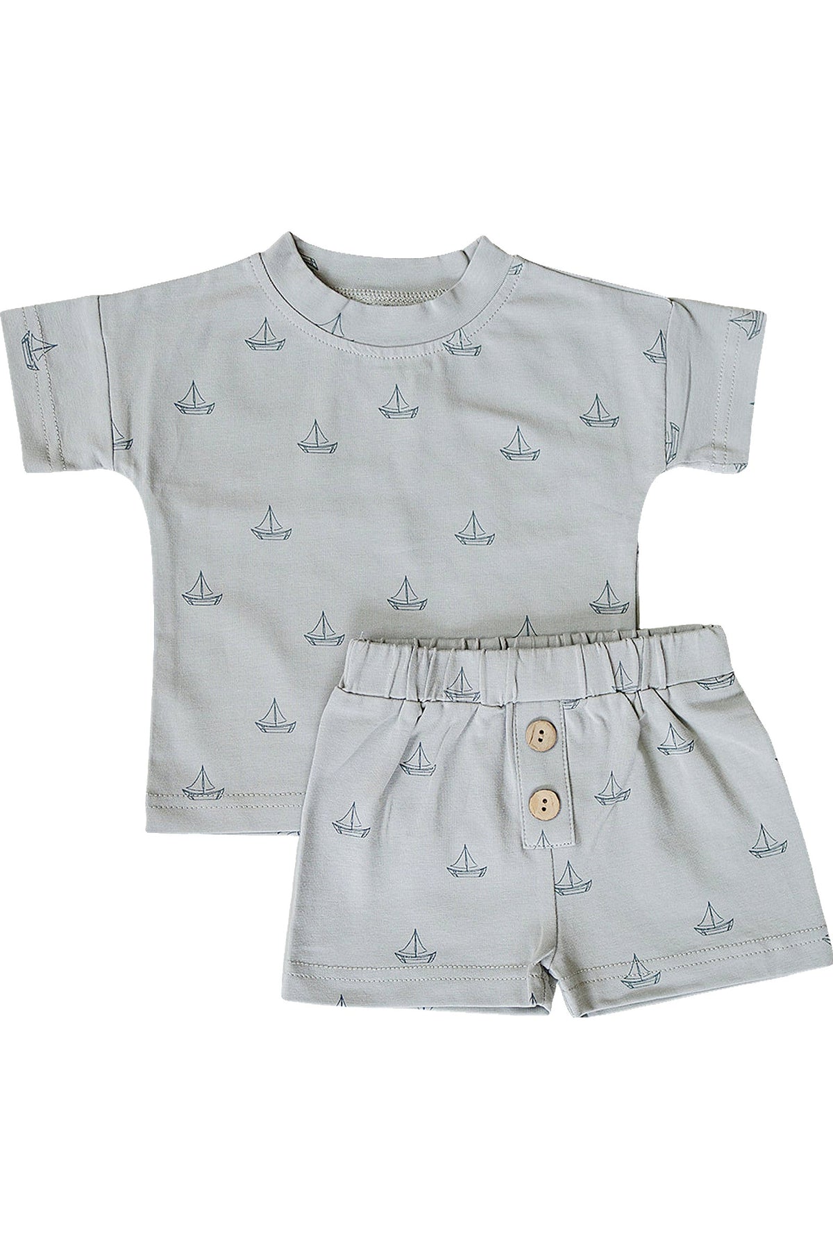 Light grey cotton shorts set featuring a short-sleeve shirt and coordinating shorts adorned with a sailboat print. Ideal for boys aged 0-6, combining comfort and playful style.