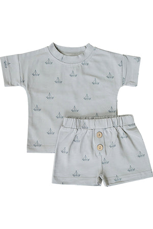 Light grey cotton shorts set featuring a short-sleeve shirt and coordinating shorts adorned with a sailboat print. Ideal for boys aged 0-6, combining comfort and playful style.