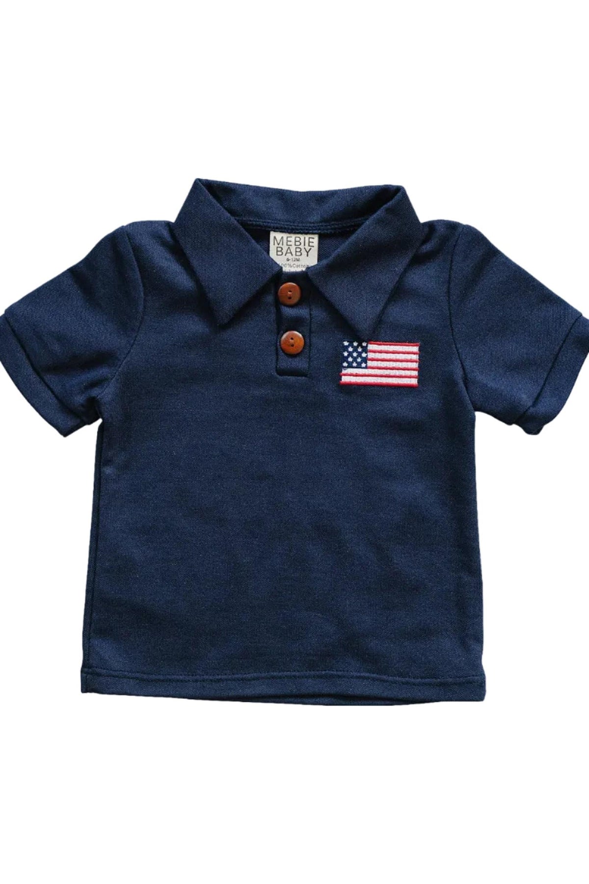 Navy blue cotton polo shirt by Mebie Baby featuring a classic collar and a decorative flag patch. Ideal for kids, this lightweight and soft shirt is perfect for warm-weather activities.