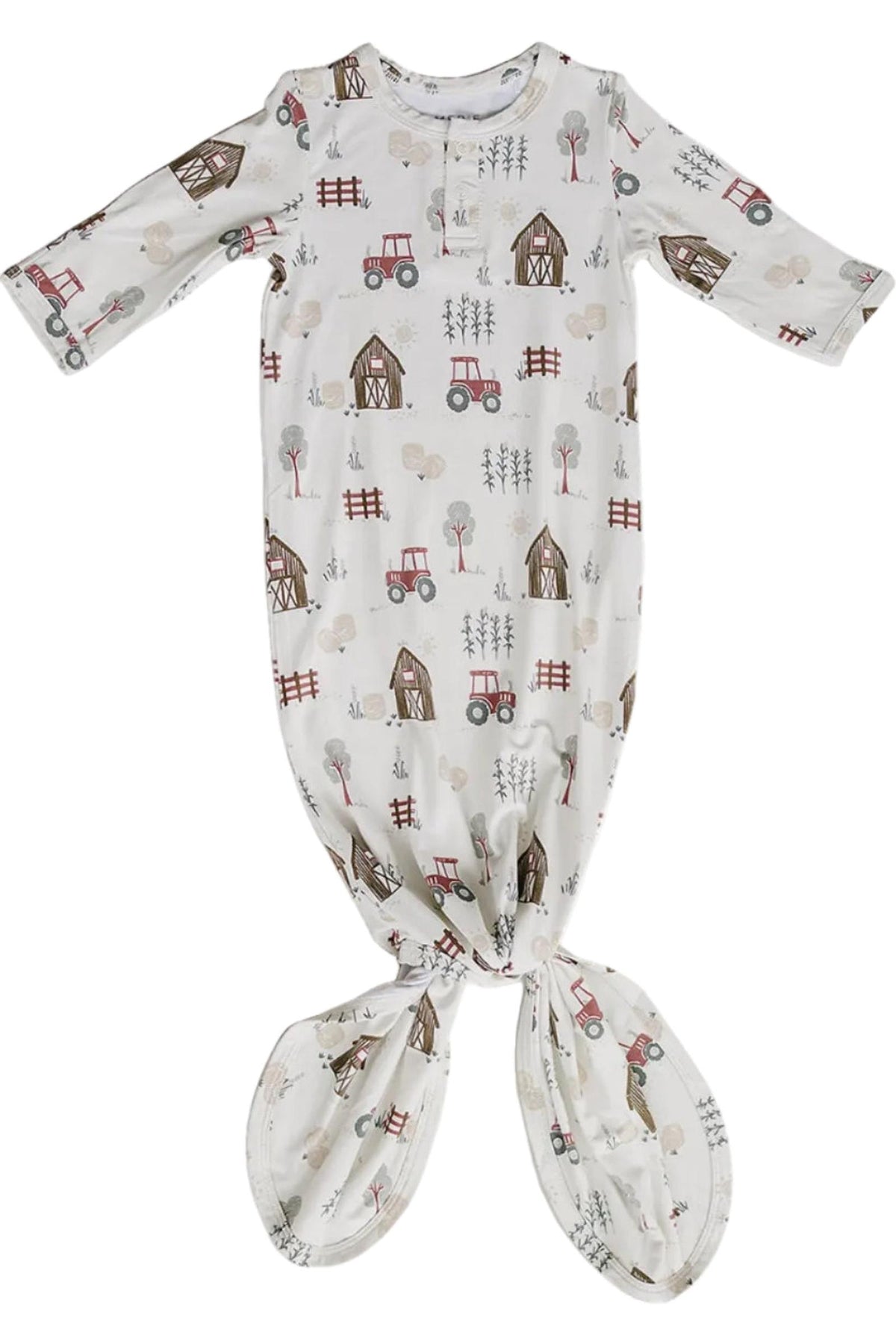 A soft, bamboo rayon baby gown features a whimsical farm print with tractors, barns, and trees.