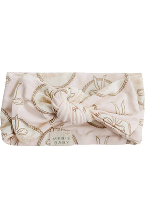 A soft, vintage-style bamboo head wrap in pale pink features a decorative knot at the front. The fabric is lightweight and gentle, ideal for babies.