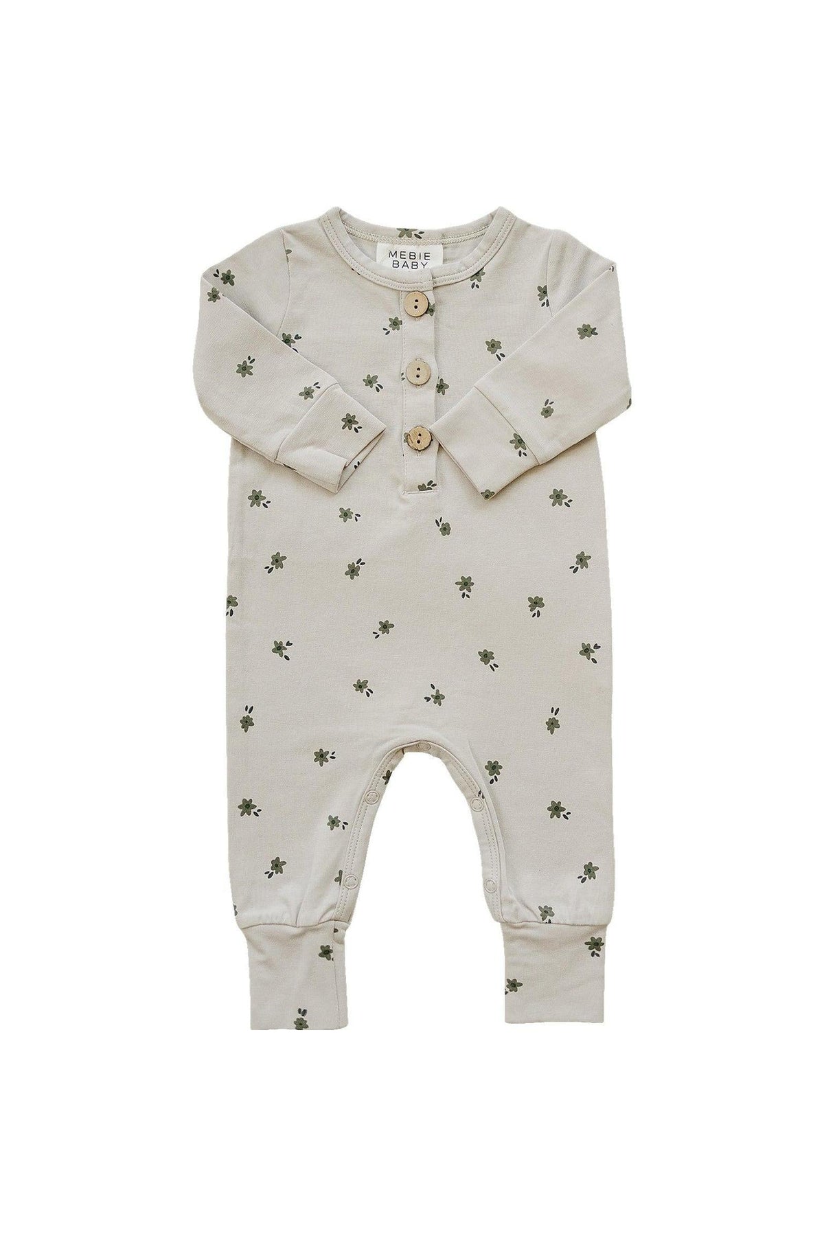 Cream-colored baby romper with a floral pattern and button-up front, made from cotton. Suitable for infants.