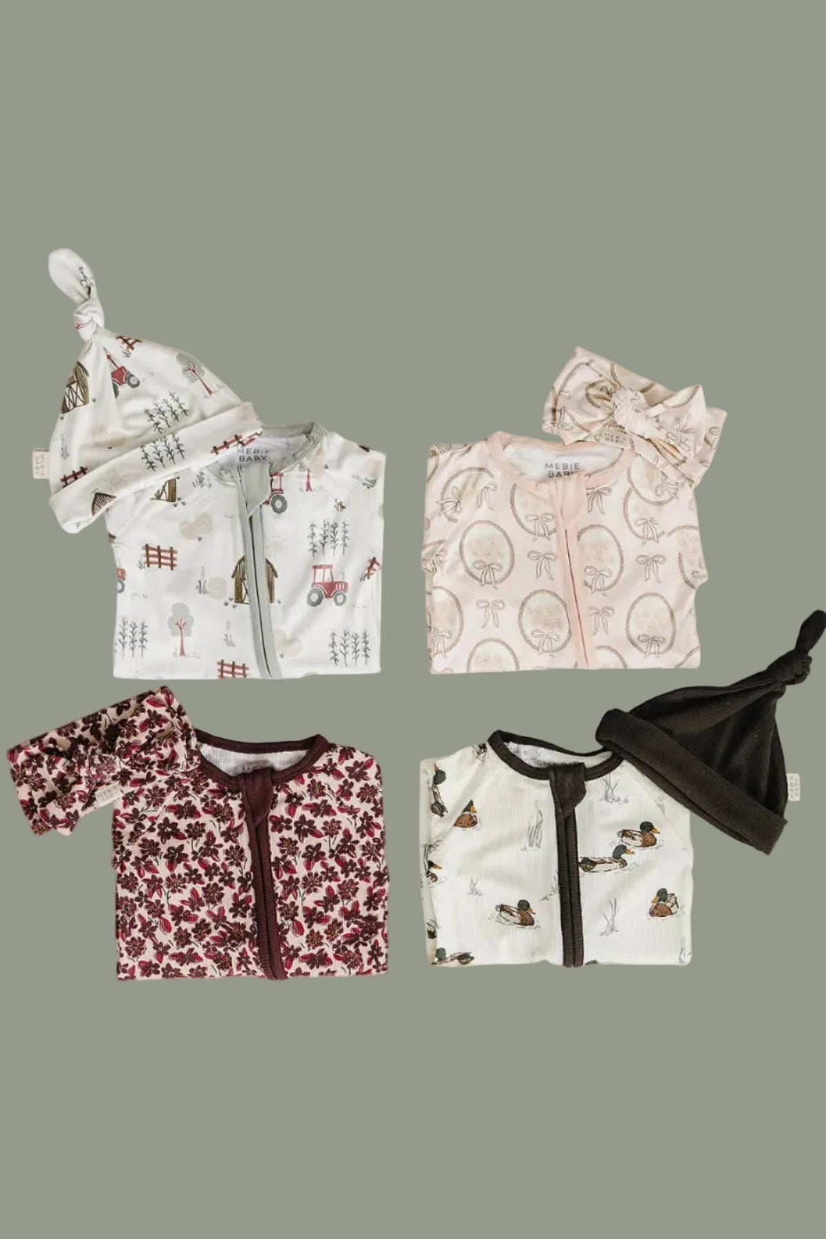 A flat lay displays four sets of baby pajamas in various colors and patterns, with coordinating hats. The fabrics feature floral and whimsical designs, ideal for sustainable and eco-friendly childrens.