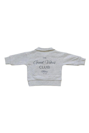 Gray sweatshirt with The Good Vibes Club text on the back, featuring long sleeves and a collar.