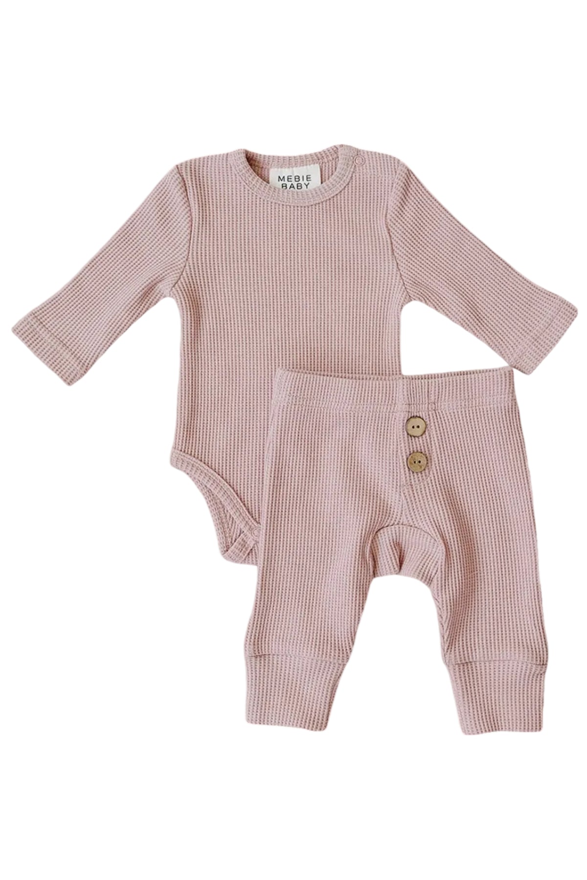 Dusty pink waffle knit cotton baby set featuring a long sleeve bodysuit and relaxed fit pants, designed for comfort and style. Perfect for cozy everyday wear for little ones.