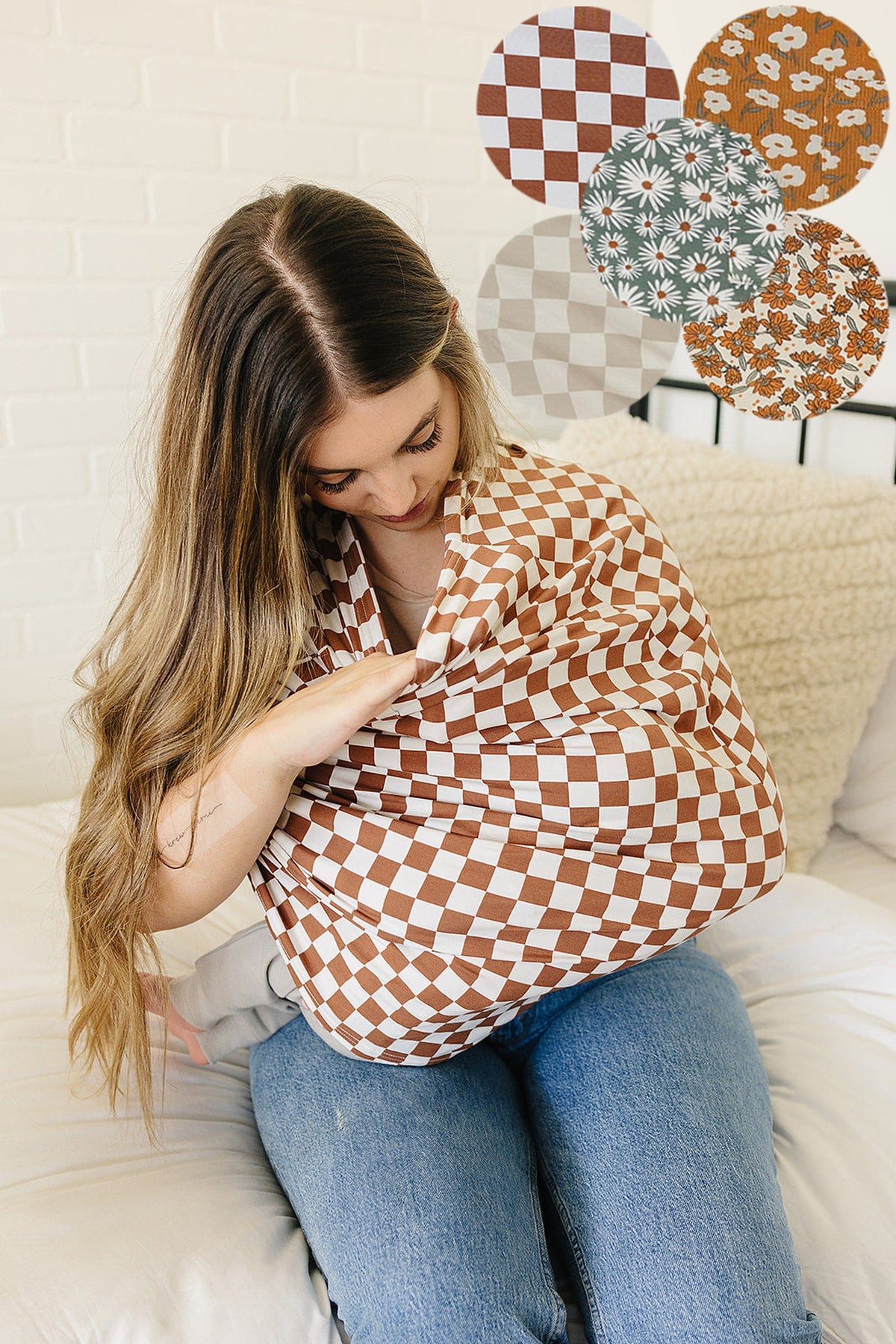 A woman uses a brown and white checkered multi-use cover while sitting on a bed, with pattern samples displayed.