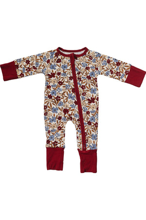 Floral-patterned bamboo zipper pajamas for baby girls, featuring a cream base with red and blue flowers, and contrasting red cuffs.