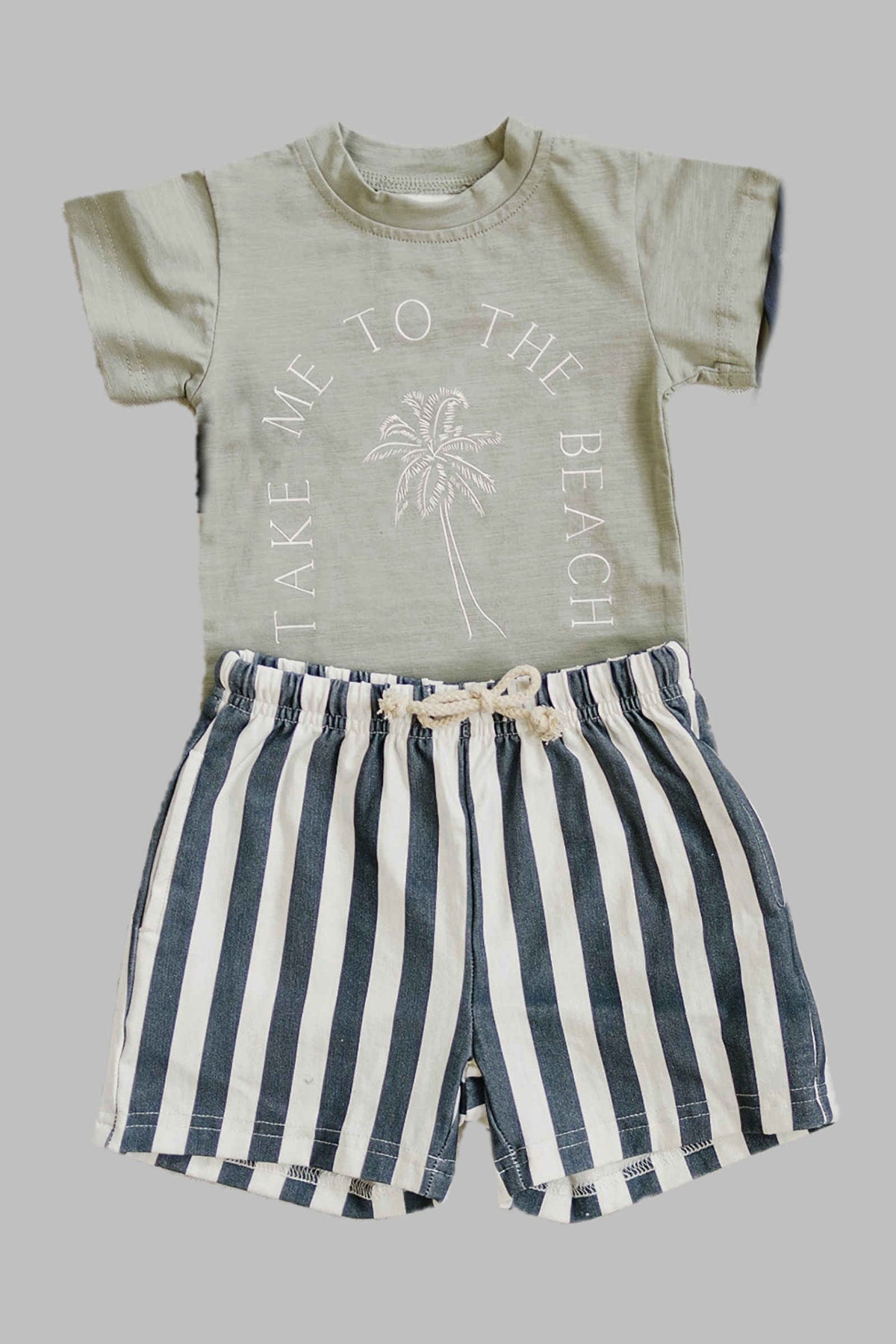 Green t-shirt with Take Me to the Beach text and palm graphic, paired with black and white striped shorts.