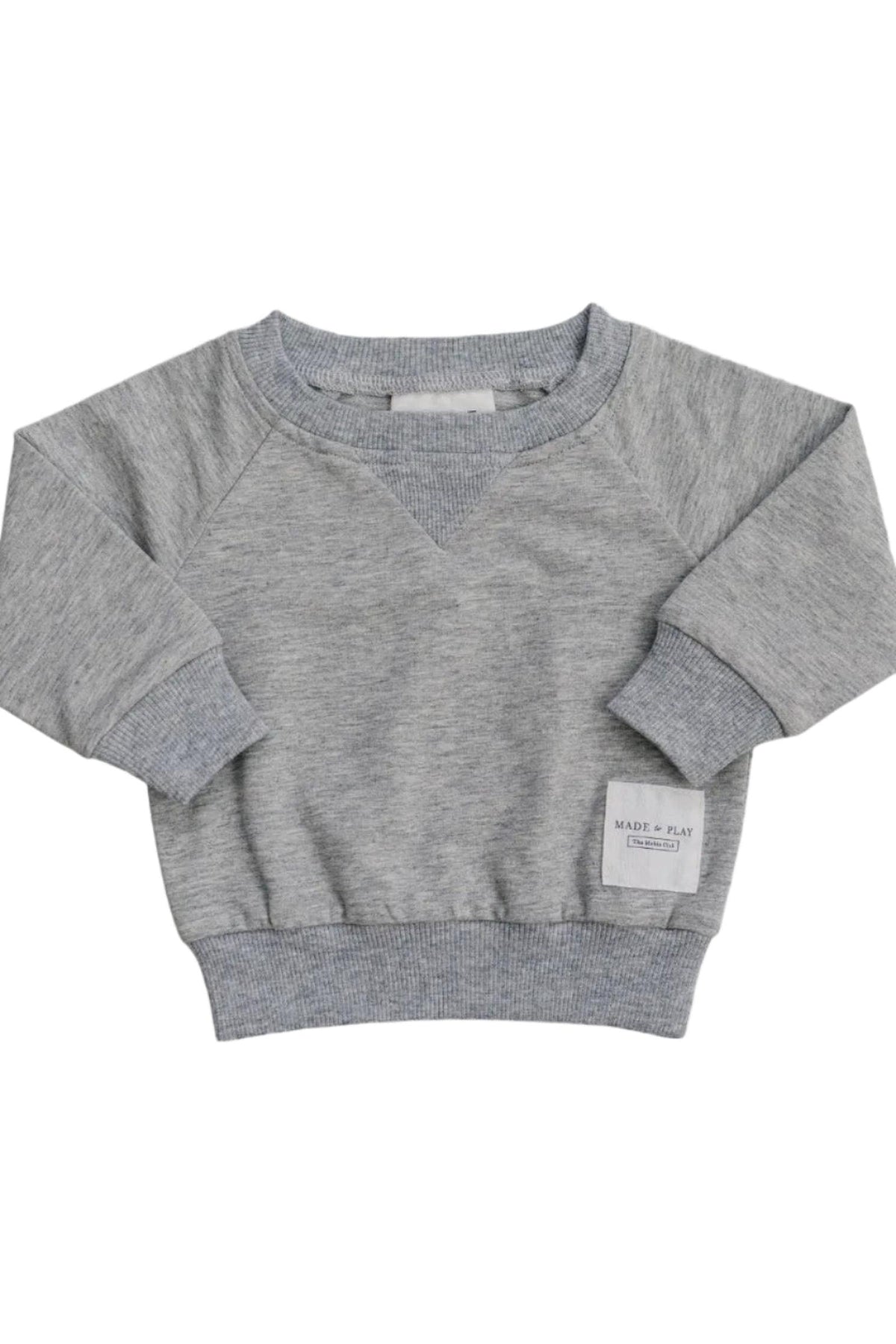 A soft grey cotton crewneck sweatshirt featuring a ribbed neckline and cuffs. It has a small Made + Play label, perfect for kids everyday adventures and comfortable wear.