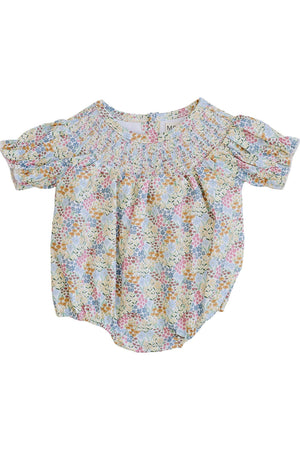 Lightly gathered baby romper with a floral print in pastel colors, featuring puff sleeves and a smocked neckline.