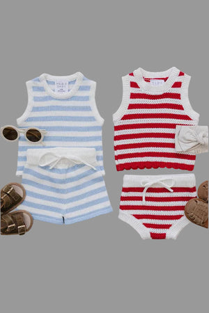 Two sets of baby outfits are displayed: a blue and white striped tank and shorts set, alongside a red and white striped tank and bloomer set.