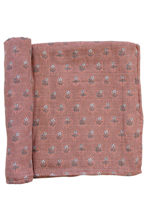 A pink floral muslin swaddle blanket with a vintage pattern, made from soft 100% cotton fabric.